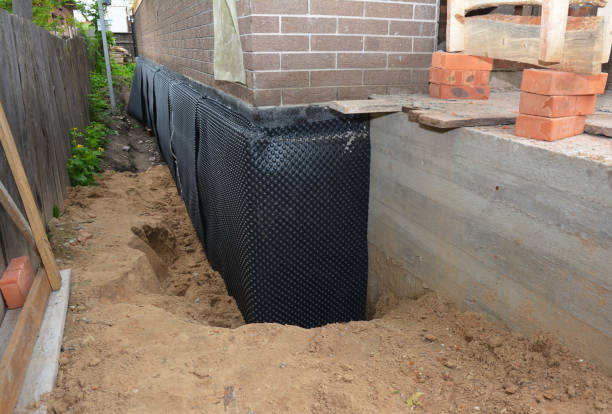 Happy homeowners after waterproofing job in Broadway